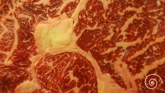 A close up of a raw steak